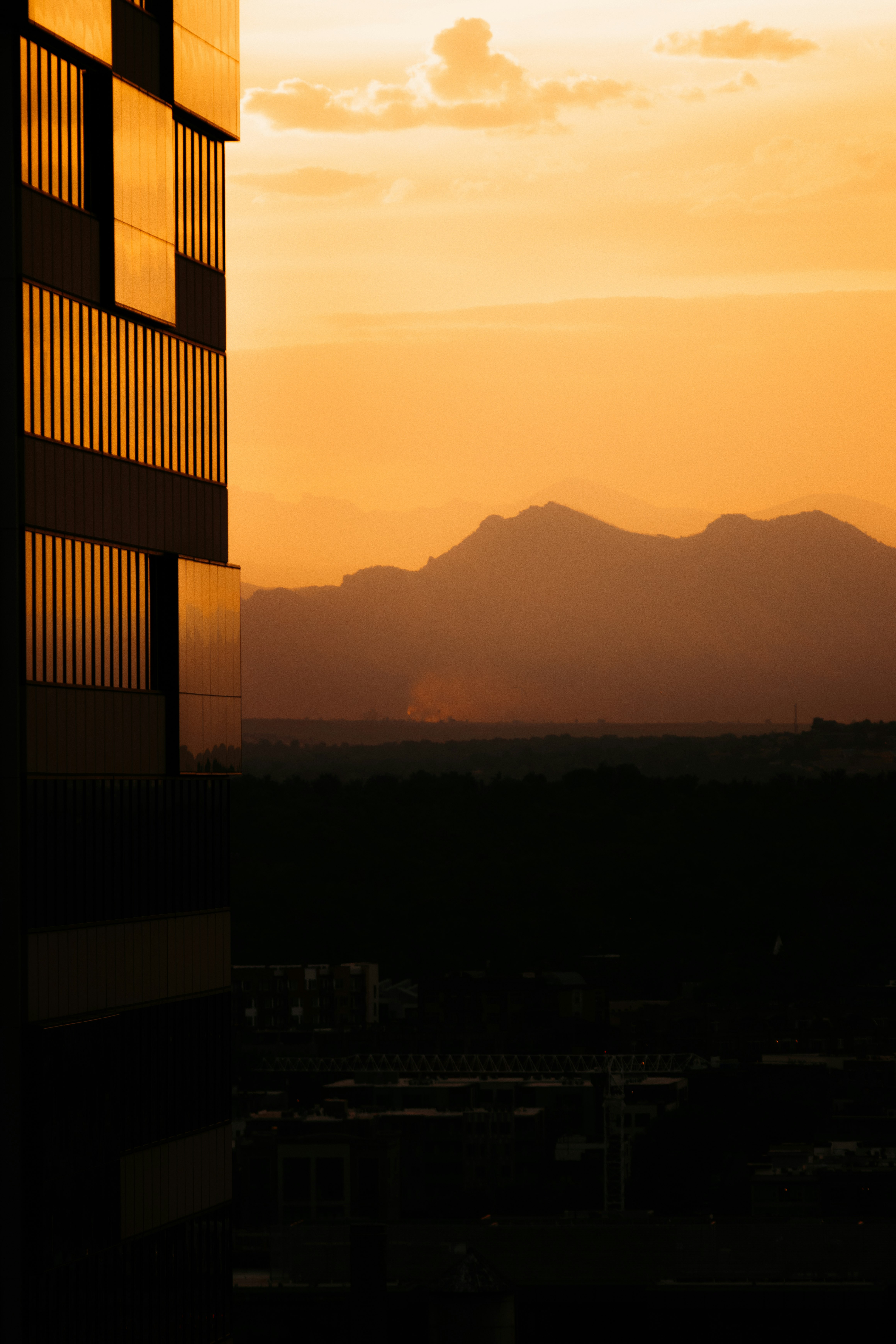 silhouette of building during sunset